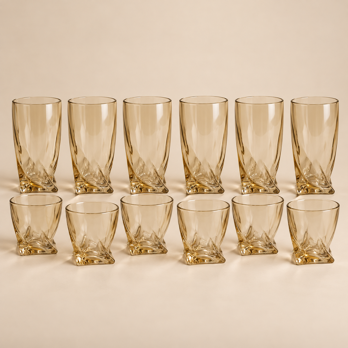 Six 270 ml tumblers and six 170 ml amber glasses on a light beige studio background
