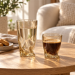 One Aurelia 270 ml amber tumbler with water and one 170 ml glass with coffee in a sunlit home