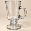 Close-up of the Clara cup's clear glass handle and decorative pedestal base