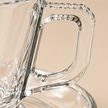 Close up of textured clear glass coffee cup handle
