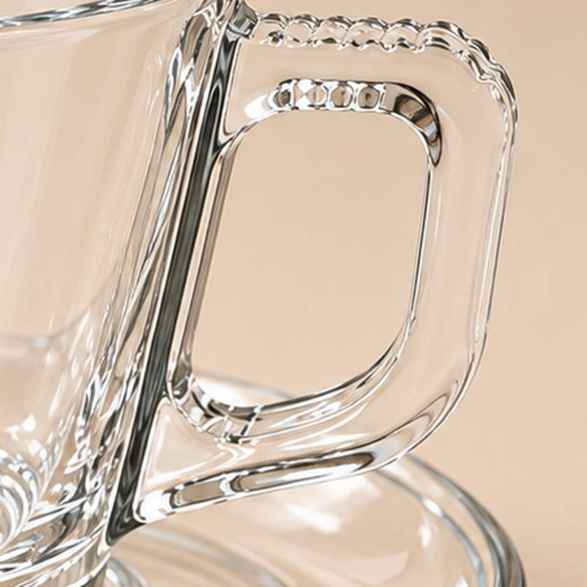 Close up of textured clear glass coffee cup handle