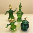 Close-up view showing handcrafted emerald glass ribbing and gold ornaments