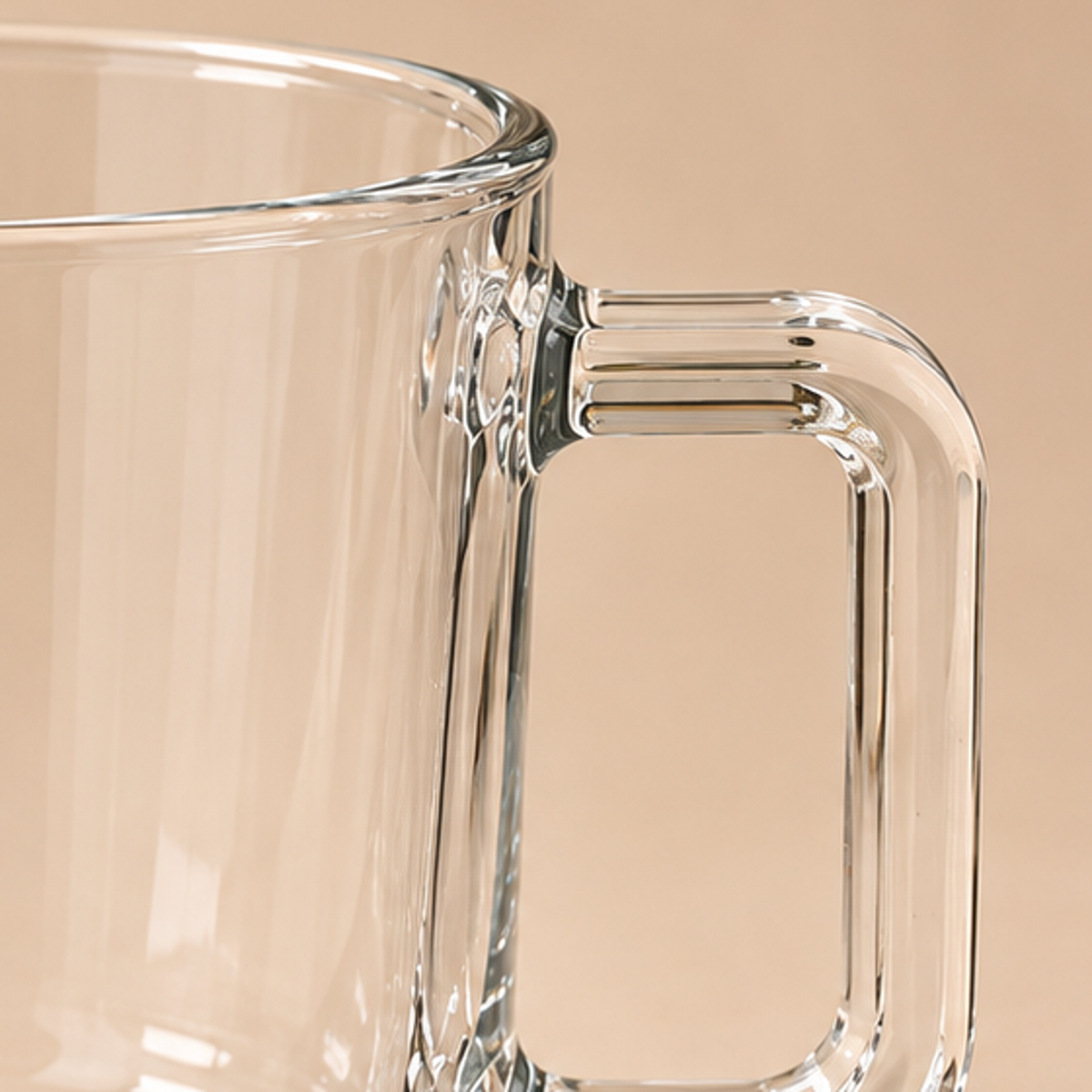 Close up of glass mug handle and rim