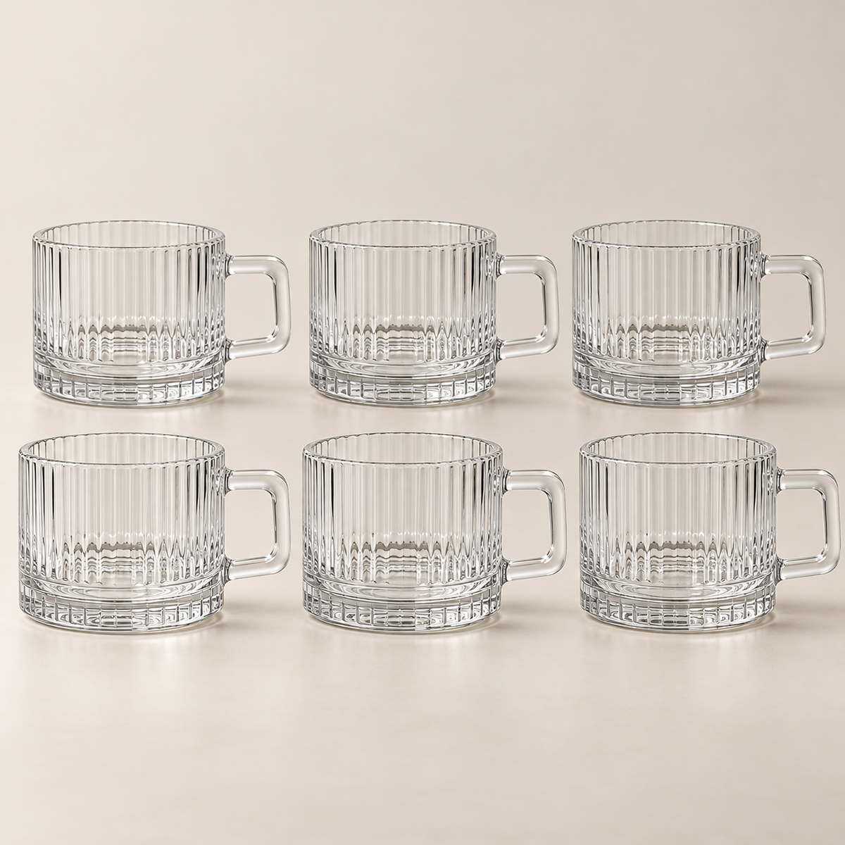 Six Lina transparent 80 ml coffee cups on a light beige studio background