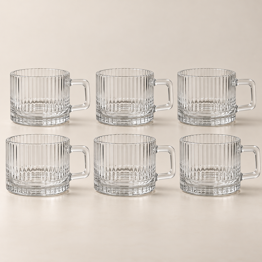 Six Lina transparent 80 ml coffee cups on a light beige studio background