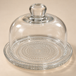 Close-up of the patterned glass plate and clear dome with glass knob