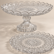 Close-up of Rosette glass floral pattern, scalloped rim and footed pedestal