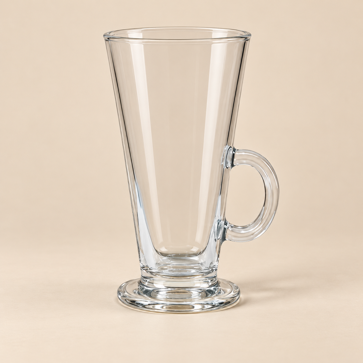 Vista 250 ml clear footed glass mug on a light beige studio background