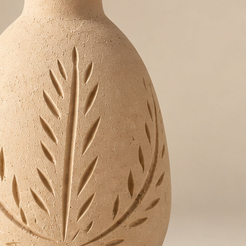 Cream botanical carved pottery vase on light beige background