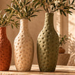 Dimpled pottery vase set in warm lifestyle setting