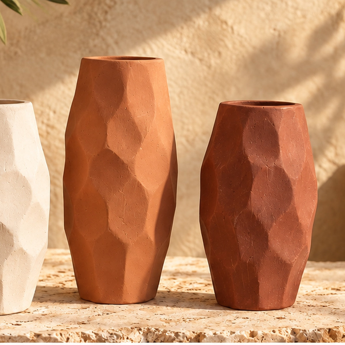 Faceted pottery vase set in warm lifestyle setting