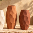 Faceted pottery vase set in warm lifestyle setting