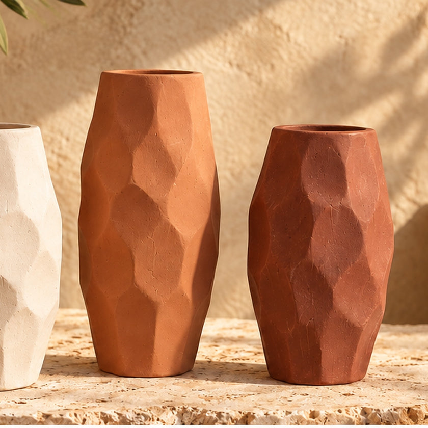 Faceted pottery vase set in warm lifestyle setting