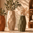 Faceted pottery vase set in a warm lifestyle setting