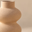 Sand beige sculptural pottery vase studio view
